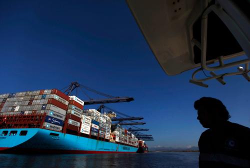 A container ship is docked in the port of Lazaro Cardenas November 21, 2013. When the leaders of Mexico and China met last summer, there was much talk of the need to deepen trade between their nations. Down on Mexico's Pacific coast, a drug gang was already making it a reality. The Knights Templar cartel, steadily diversifying into other businesses, became so successful at exporting iron ore to China that the Mexican Navy in November had to move in and take over the port in Lazaro Cardenas, a city that has become one of the gang's main cash generators. Picture taken November 21, 2013. To match Feature MEXICO-DRUGS/PORT REUTERS/Edgard Garrido (MEXICO - Tags: POLITICS CRIME LAW DRUGS SOCIETY BUSINESS MARITIME)