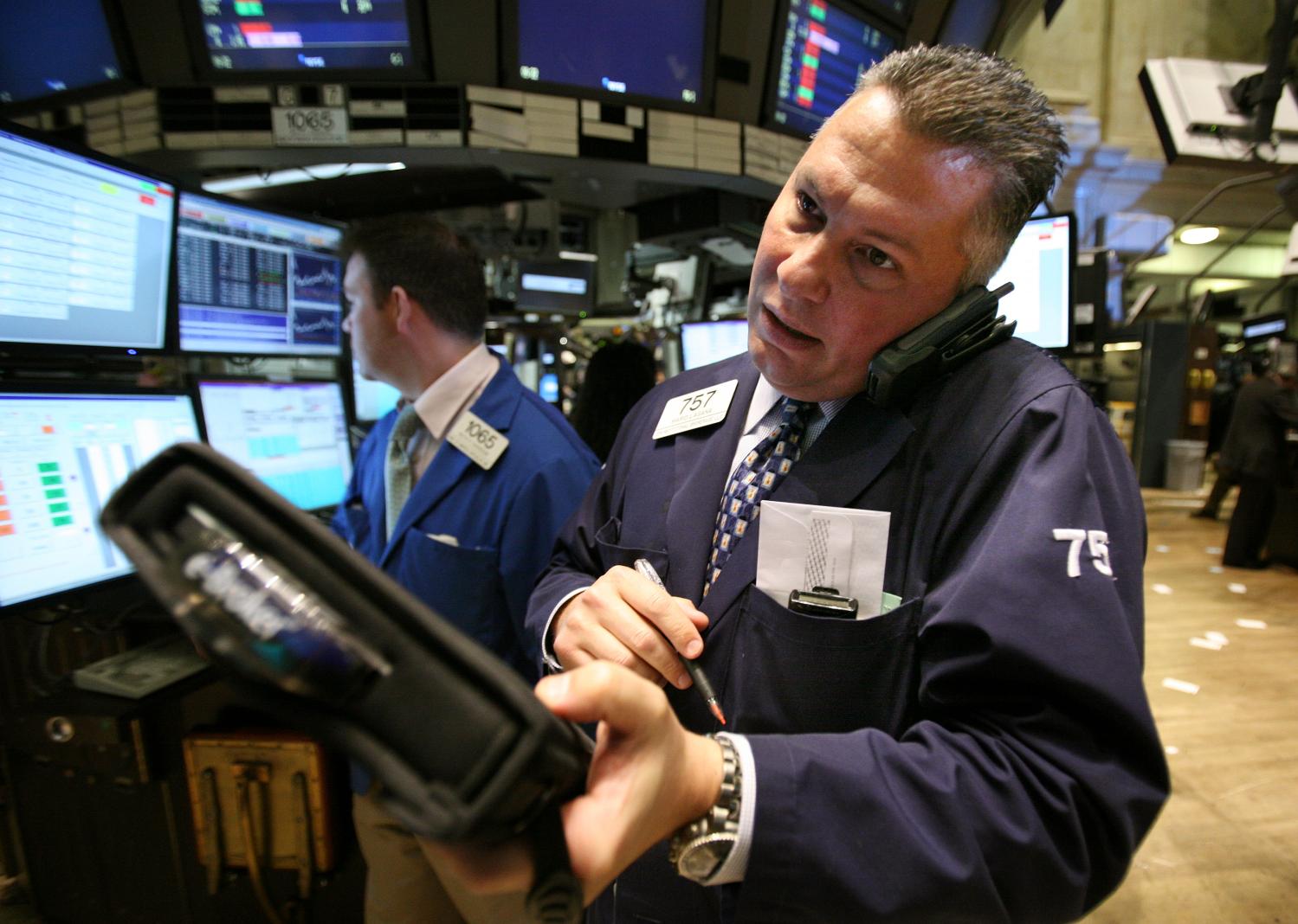 Traders work on the floor of the New York Stock Exchange